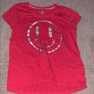Red smiley face shirt